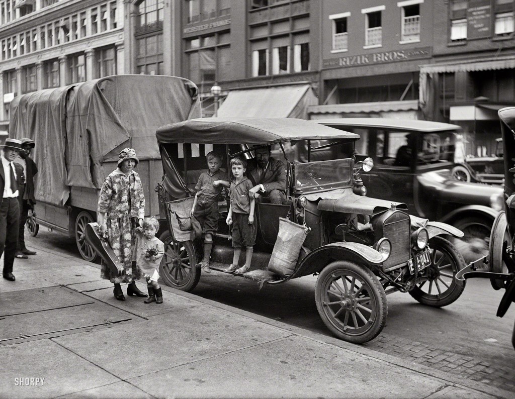 May 1921. Washington, D.C. Professor Charles Seeger, a composer, his wife is a distinguished violinist, Little Pete Seeger, 2 years old, and family along with their camping rig, While Living Outdoors LIKE WANDERING MINSTRELS.